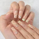 Hand with French manicure nails featuring white and green designs on a light background, Obroi