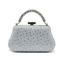 Silver handbag with rhinestone embellishments on a white background, Obroi