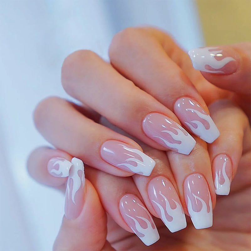 Hand with pink and white flame nail design on a blurred background, Obroi