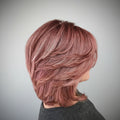Close-up of a person with pink hair in a salon , Obroi
