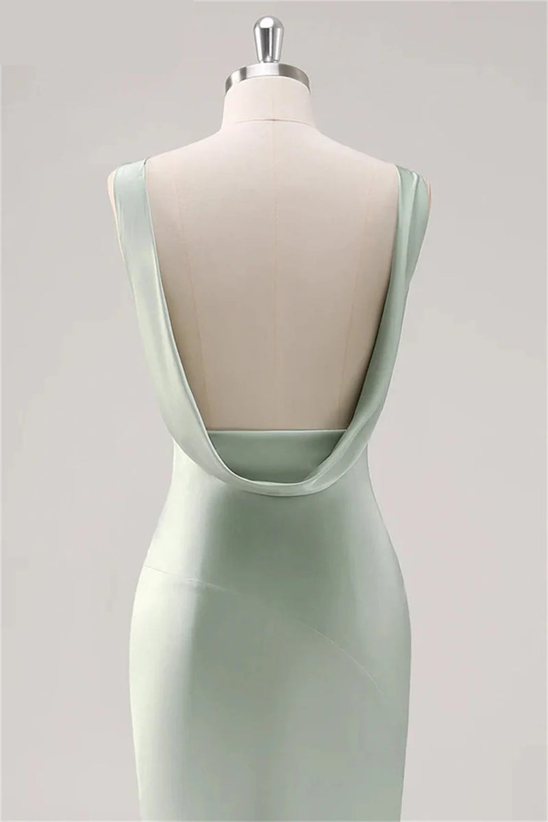 Mint green dress on a mannequin against a light gray background