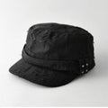 Black distressed cap with metal embellishments on a white background, Obroi