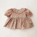 Floral dress with puff sleeves on a light background, Obroi