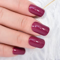 Close-up of a hand with dark pink nail polish on a white background, Obroi