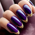 Close-up of a hand with purple nails and gold glittery tips, Obroi