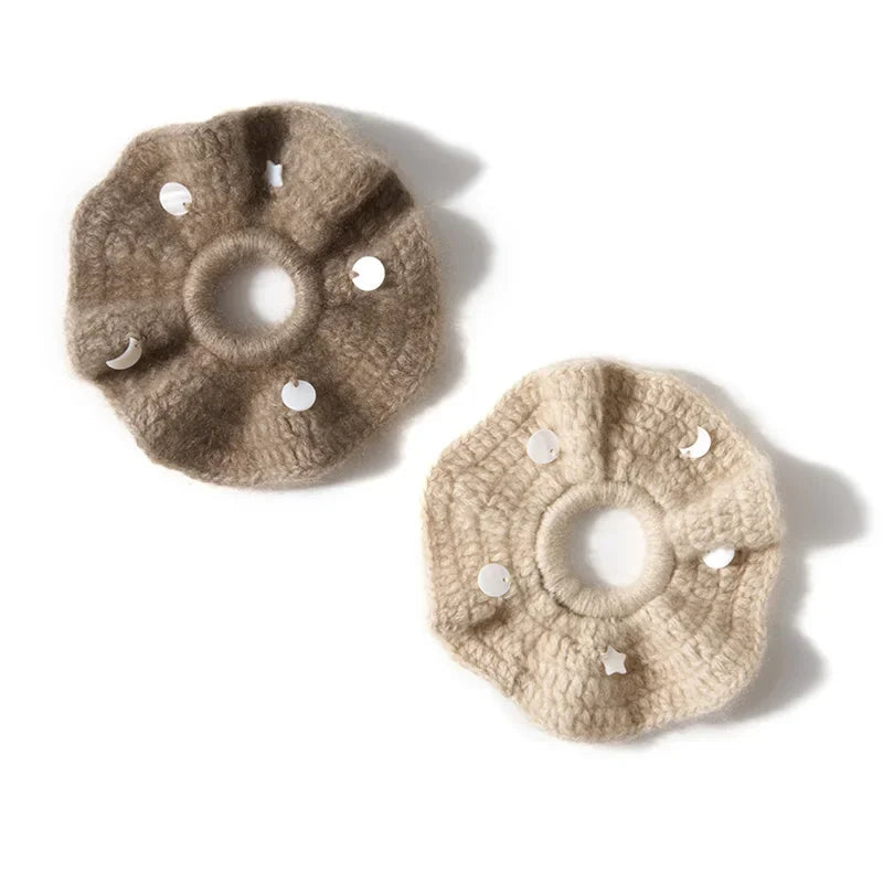 Two beige cashmere scrunchies on a white background with 'Pure Premium Cashmere' .