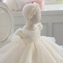 White floral dress on a mannequin against a neutral background, Obroi