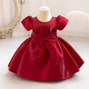 Red dress on a mannequin against a white background, Obroi