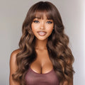 Woman with long, wavy brown hair and a neutral background, Obroi