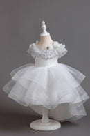 White children's dress with ruffled top on a mannequin against a gray background, Obroi