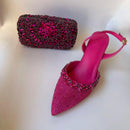 Pink high-heeled shoe with embellishments and matching clutch on a white background, Obroi