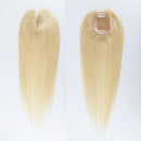 Two blonde hair extensions on a white background, Obroi