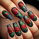 Nails with black and red rose design on a hand, Obroi