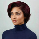 Woman with a stylish haircut wearing a navy turtleneck against a light background, Obroi