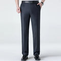 Dark gray pants worn by a person on a white background, Obroi