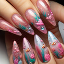 Nail art with underwater theme featuring fish, coral, and bubbles on a clear background, Obroi