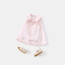 Pink baby dress with matching shoes on a white background, Obroi