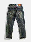 Back view of a pair of dark blue jeans on a white background, Obroi