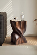 Wooden side table with a bottle and cup on a light-colored floor, Obroi
