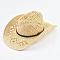 Beige straw cowboy hat with a black band on a white background