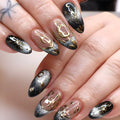 Nails with black and gold design on a neutral background, Obroi