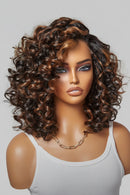 Mannequin head with a curly brown wig on a plain background, Obroi