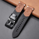 Black and brown leather watch strap with embossed design on a gray surface, Obroi