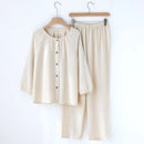 Beige pajama set on hangers against a white background, Obroi