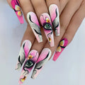 Nails with artistic designs featuring eyes and flowers on a light background, Obroi
