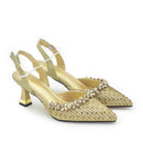 A pair of gold pointed-toe slingback heels embellished with rhinestones and set on a chunky block heel, shown against a plain white background, Obroi