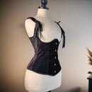 Black corset on a mannequin against a neutral background, Obroi