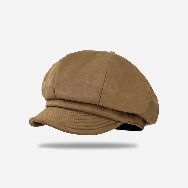 Brown suede cap on a white background with 'Obroi' branding.