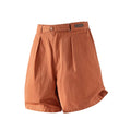 Orange shorts with a visible brand label on a white background, Obroi