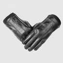 Pair of black leather gloves on a light gray background, Obroi
