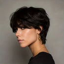 Woman with a stylish haircut and jewelry against a neutral background, Obroi
