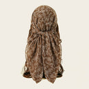 Brown floral headscarf on a plain background, Obroi