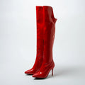 Shiny red knee-high boots on a white background, Obroi