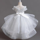 White floral dress on a mannequin against a dark background, Obroi
