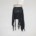 Black layered skirt with embellishments on a hanger against a white background, Obroi