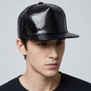 Man wearing a black textured cap against a gray background, Obroi