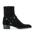 Black suede ankle boot with a strap and buckle on a white background, Obroi