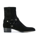 Black suede ankle boot with a strap and buckle on a white background, Obroi