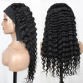 Black wavy hair wig on a mannequin head with a plain background, Obroi