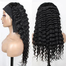 Black wavy hair wig on a mannequin head with a plain background, Obroi