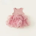 A baby girl's sleeveless dress featuring a dusty pink ribbed knit bodice with a small white embroidered 'Obroi' logo, and a voluminous layered pink tulle tutu skirt, laid flat on a light cream background.