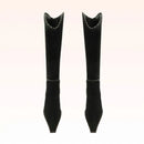 Pair of black knee-high boots on a light beige background, Obroi