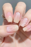 Close-up of hands with shell-shaped nails on a neutral background, Obroi