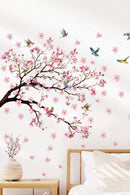 Wall decal of cherry blossom tree with pink flowers and birds in a bedroom setting, Obroi