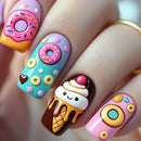 Colorful nail art with donut and ice cream designs on a neutral background, Obroi
