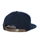 Obroi Navy blue cap with brown band on a white background
